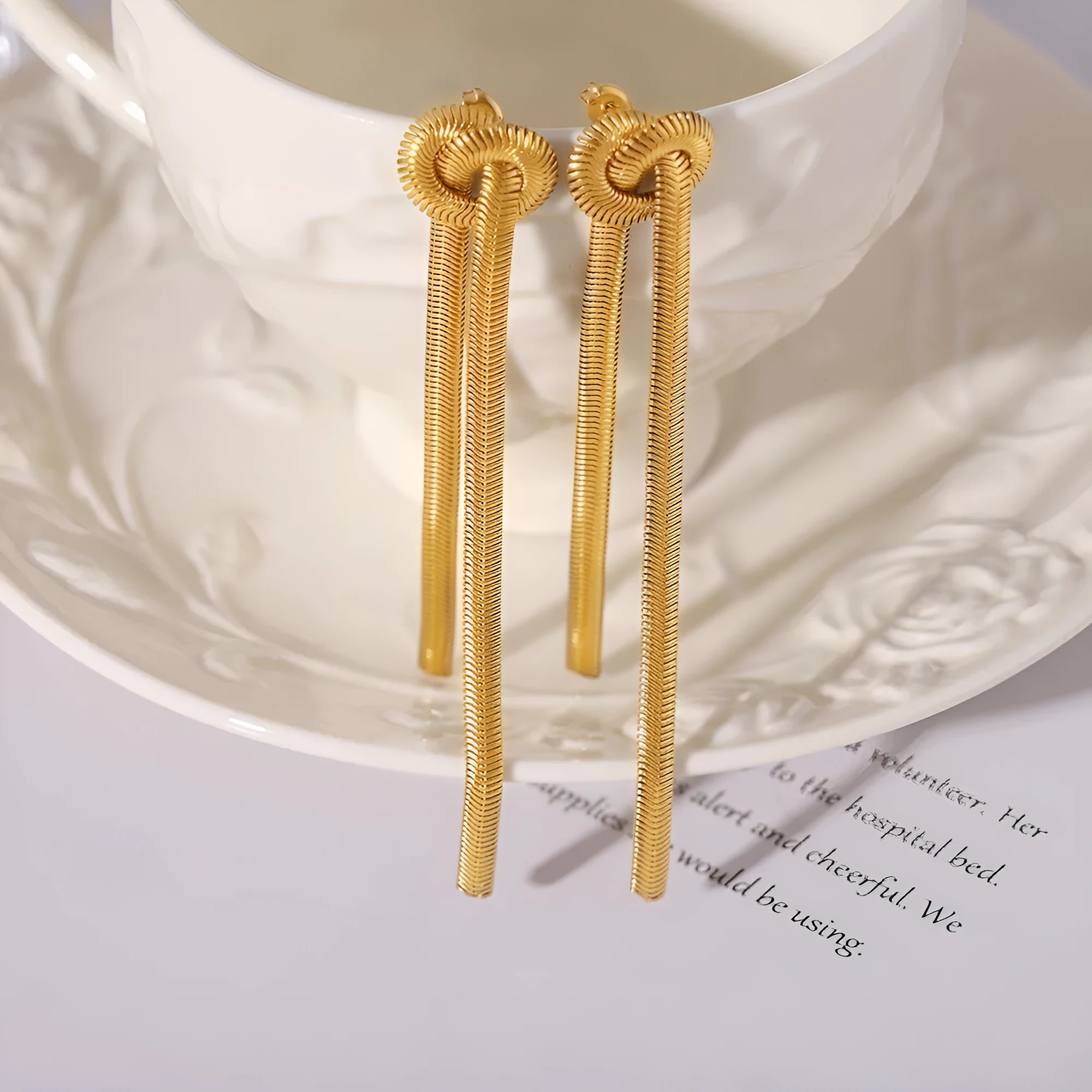 Gold electroplated titanium steel knotted tassel necklace with snake chain and matching earrings set