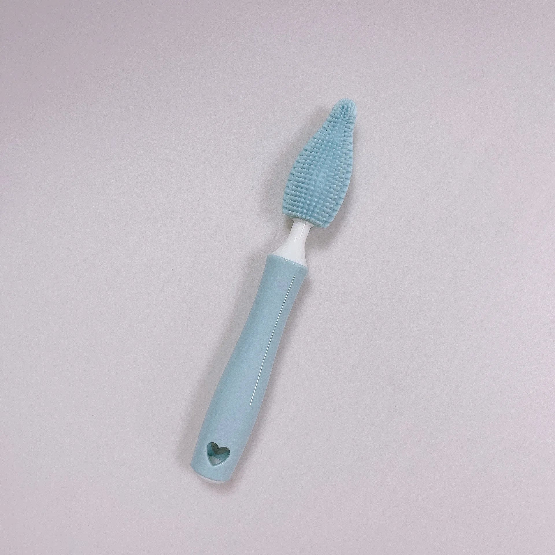 Three-piece baby bottle cleaning brush set with silicone bristles and a straw cleaner in assorted colours.