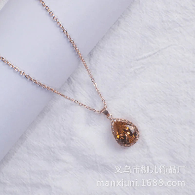 Rose gold pink drop shape women's necklace with geometric rhinestone detailing and alloy construction