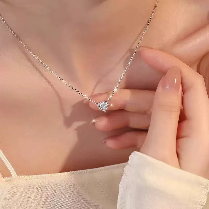 Women's silver heart necklace with copper construction and simple design