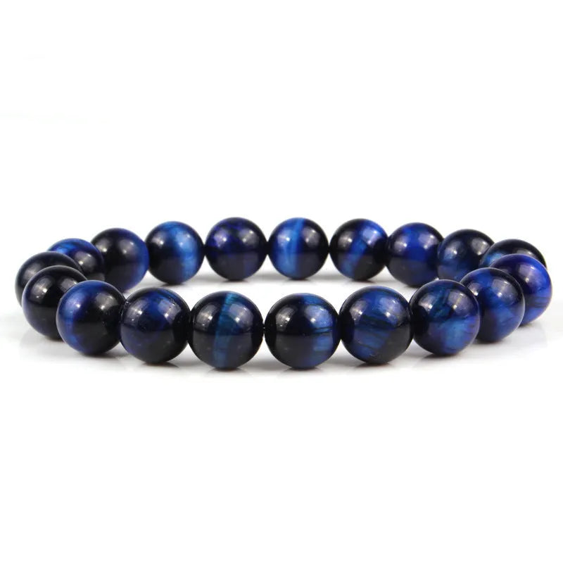 Natural tiger eye crystal beaded bracelet for men and women on a white background.