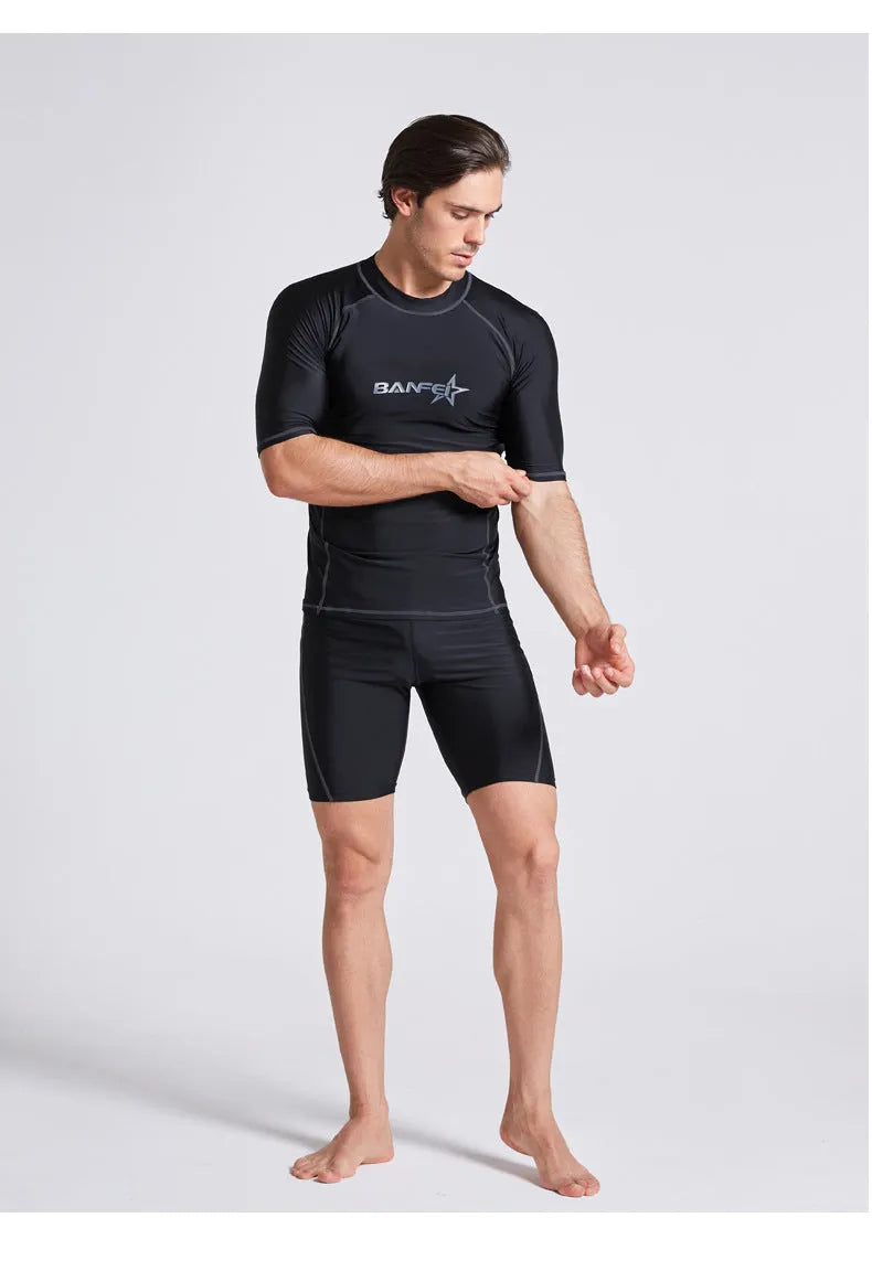 Men's navy blue half sleeve swimsuit top and pants set for swimming