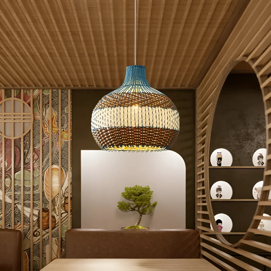 Natural woven rattan pendant ceiling light with a spherical shade in pastoral Southeast Asian style.