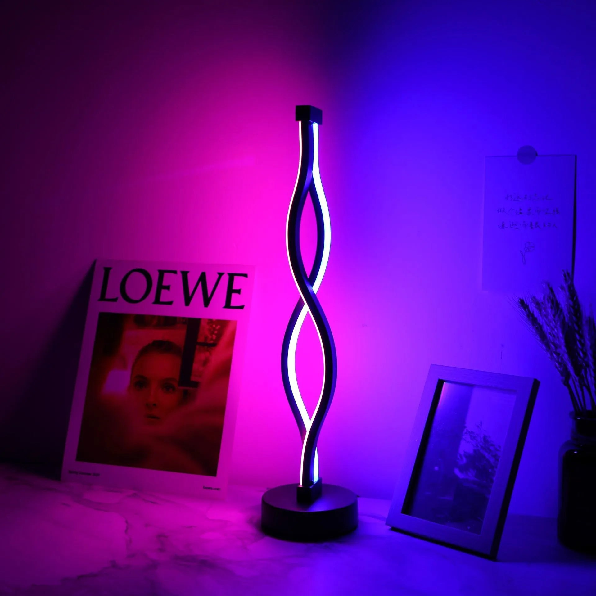 Black aluminium desk lamp with three-colour dimming button and touch controls.