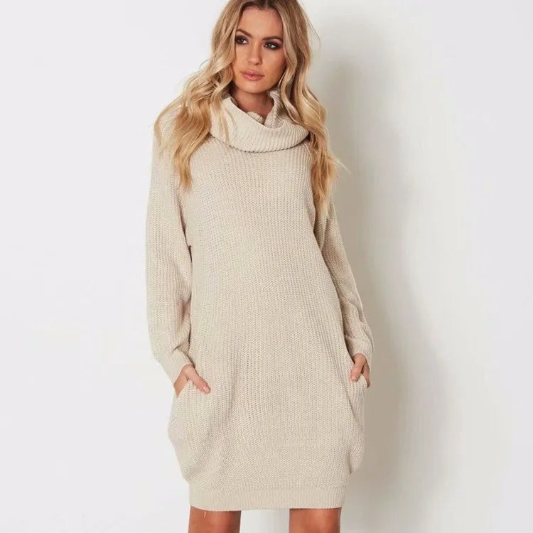 A mid-length apricot pullover sweater with a lapel neckline, loose fit, and side pockets on a hanger.