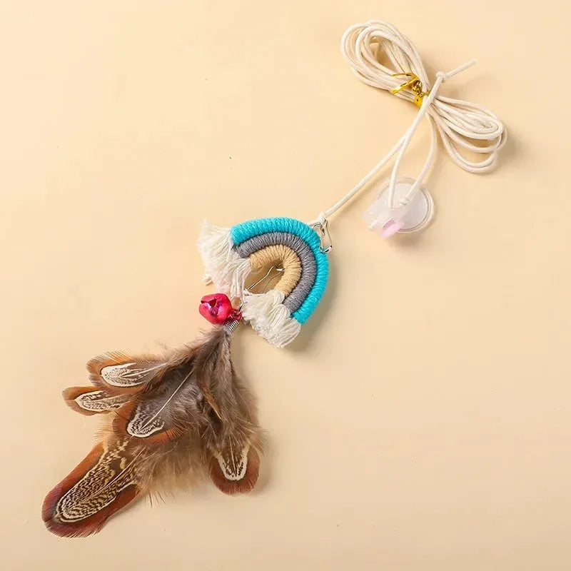 Blue feather cat rope toy hanging from a door with elastic swing and sticky buckle clamp