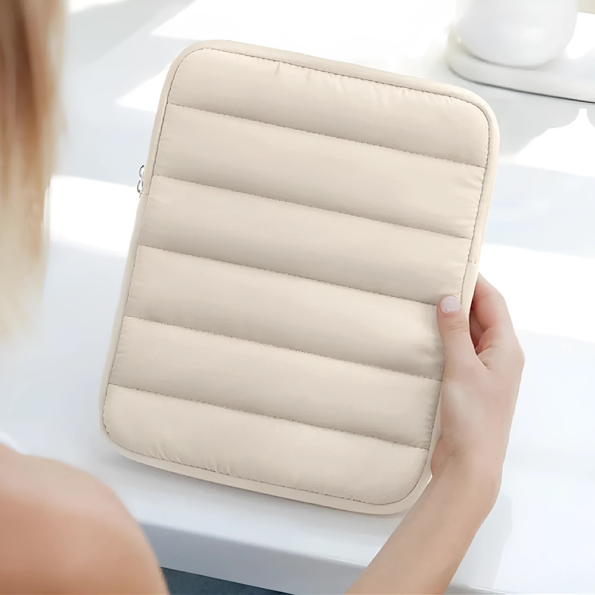 Fluffy puff bag laptop sleeve for 9.7-11 inch devices in black, khaki, or silver with elastic sides.