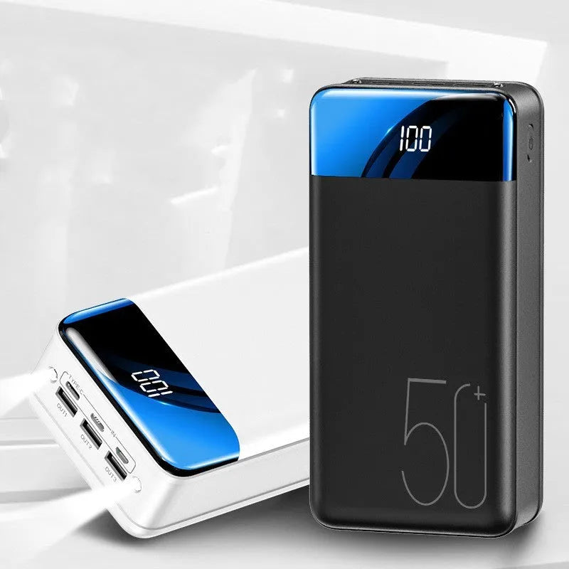 Black and white 50000mAh power bank with three USB output ports showing dimensions 169x83x52mm