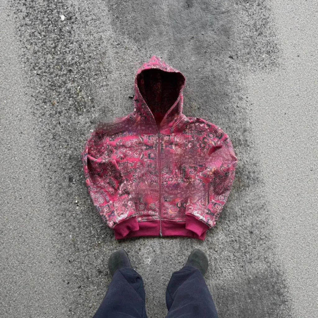 Man wearing a loose blue hooded zip-up coat with long sleeves for casual autumn wear.