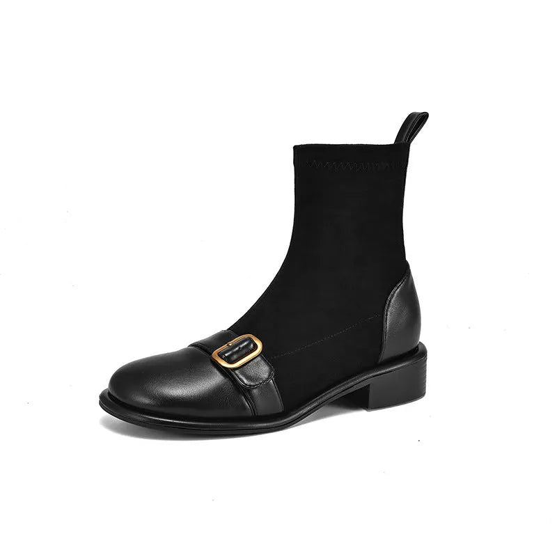 Women's black low-heel Martin ankle boots with front lace-up and belt buckle detail stitching.