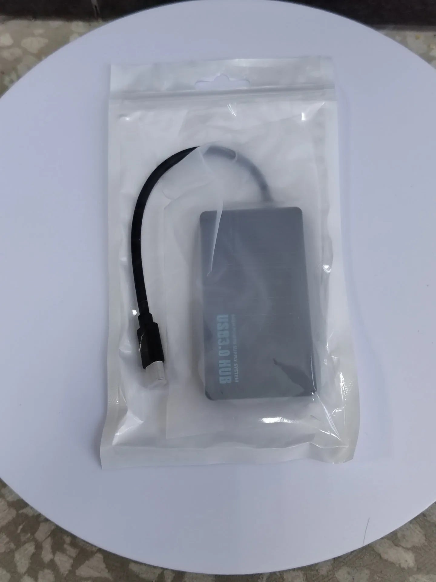 USB extender hub with 20cm cable showing multiple USB ports in pearlescent bag packaging