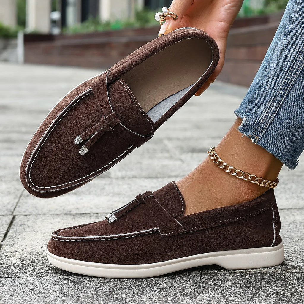 Solid colour canvas Gommino slip-on loafers with a round toe and platform heel on a rubber sole.