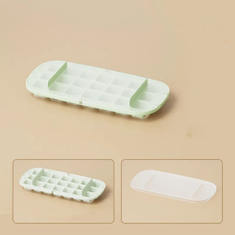 Blue high-capacity ice cube tray with integrated storage for an ice shovel.