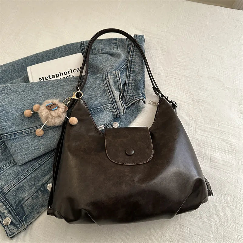 Women's black PU leather single shoulder bag with horizontal square shape and dedicated phone compartment
