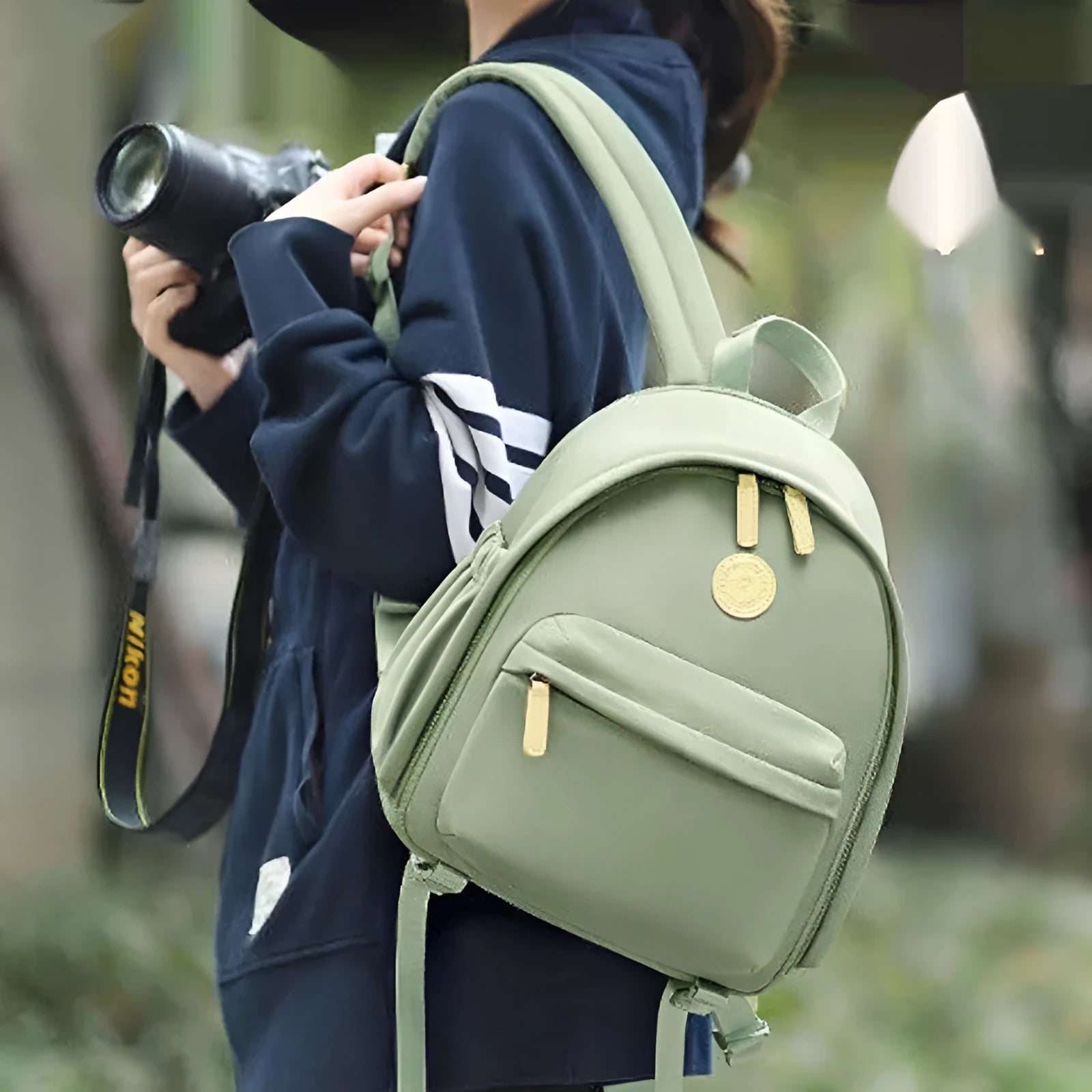 Women's solid-colour shoulder camera bag with a detachable iPad pocket in splash-proof polyester fabric.