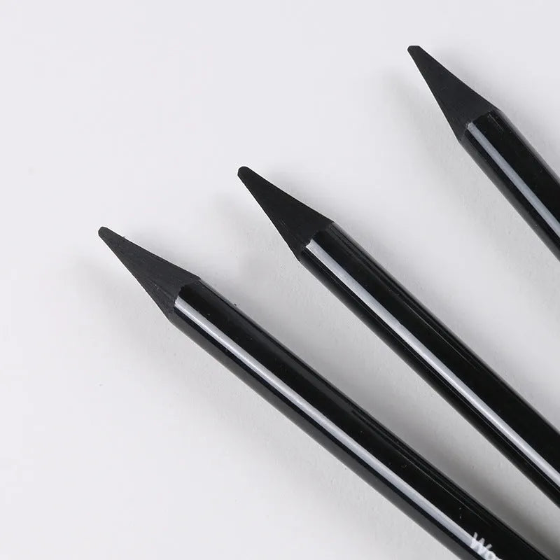 Set of nine wooden drawing pencils on a card, including graphite and carbonized pencils for sketching.
