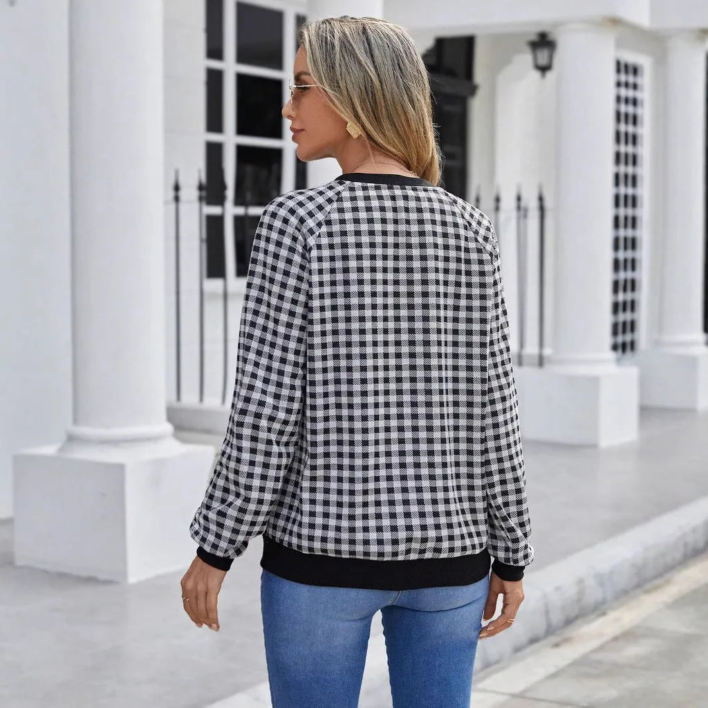 Black Japanese style plaid pullover sweater with long sleeves and printed pattern