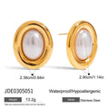 Small gold-tone stainless steel stud earrings with a white pearl accent on a grey background.