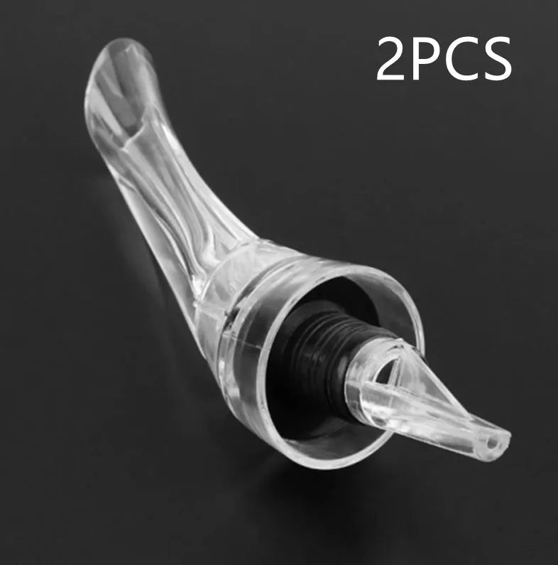 Clear acrylic wine aerator with stainless steel filter, 16cm long.