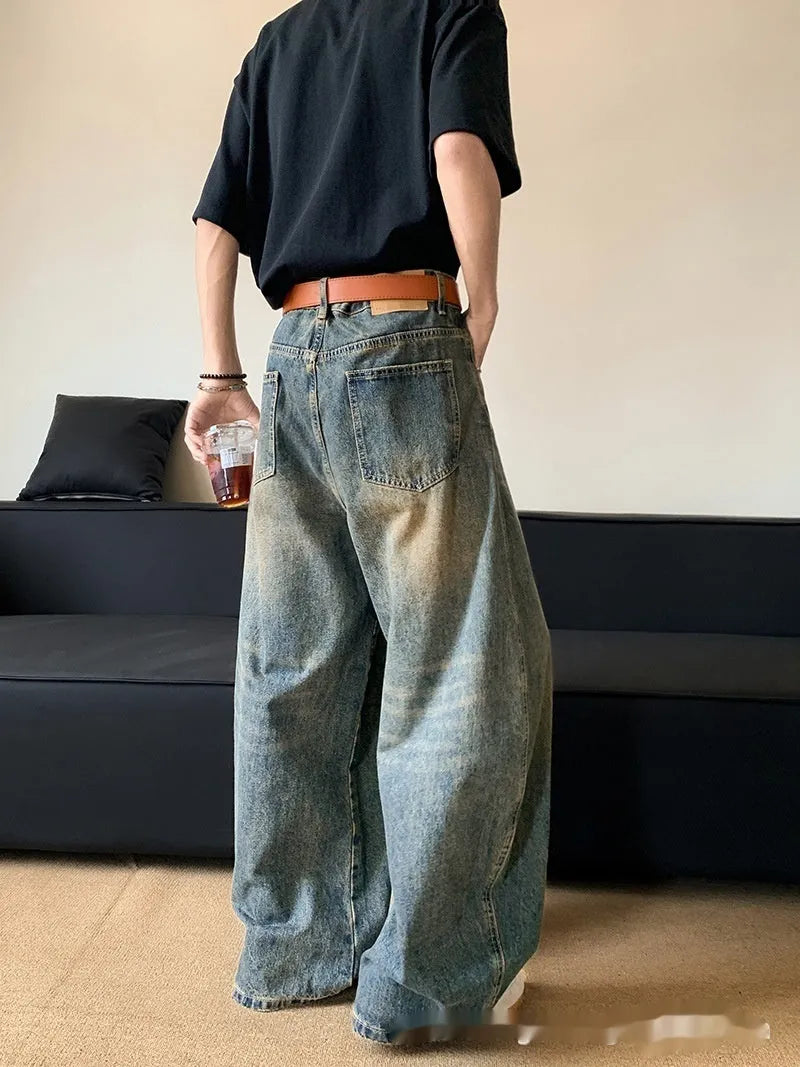 Men's retro blue distressed denim wide-leg jeans with a slimming fit and zip fly