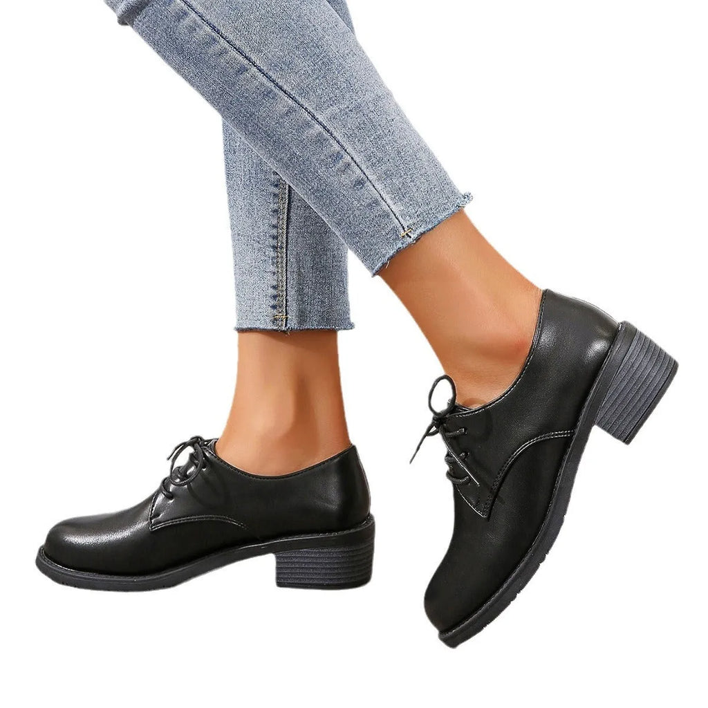Black women's work shoes with thick chunky heel, PU leather upper, and rubber sole