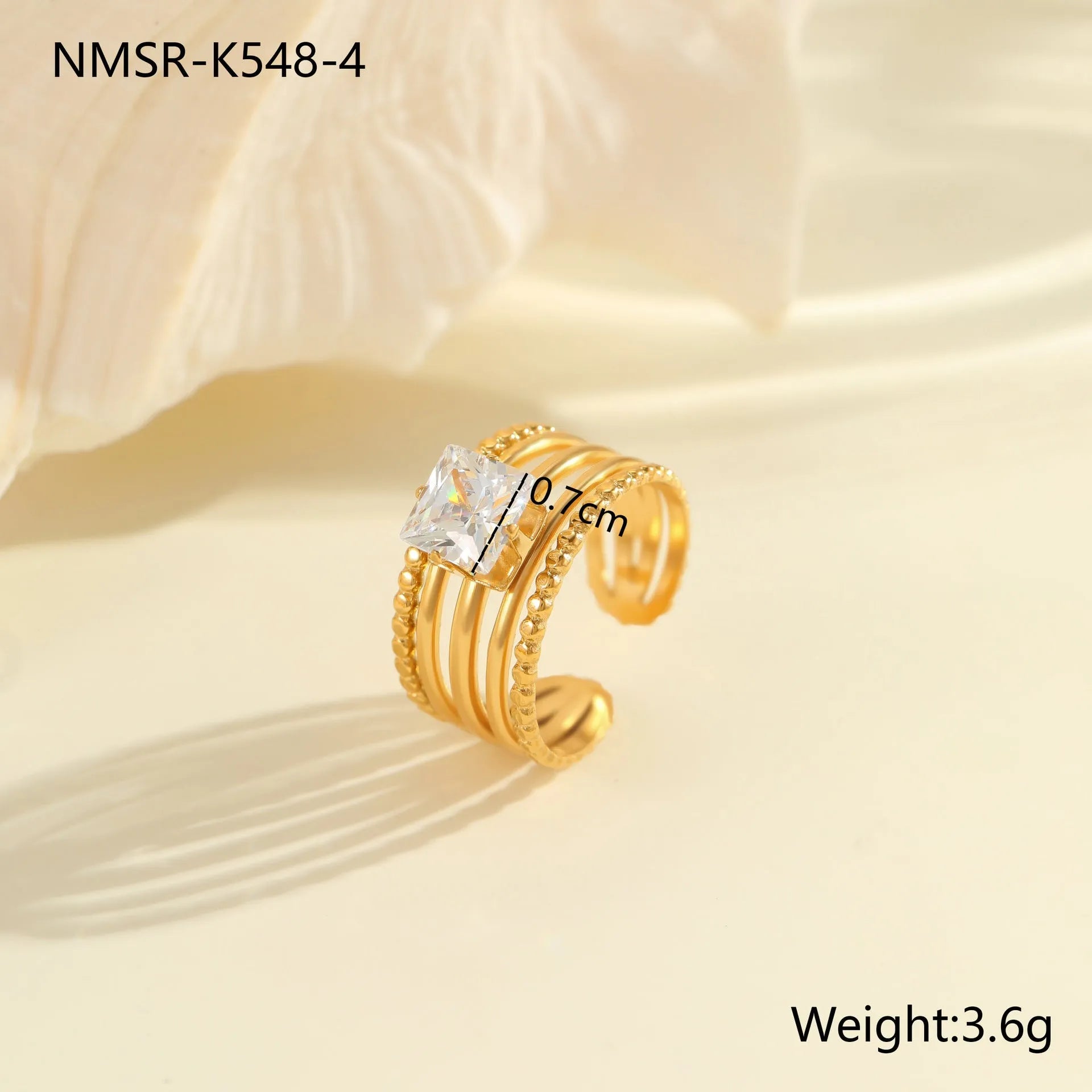 Gold-coloured stainless steel open ring with zircon stones in a geometric heart design.