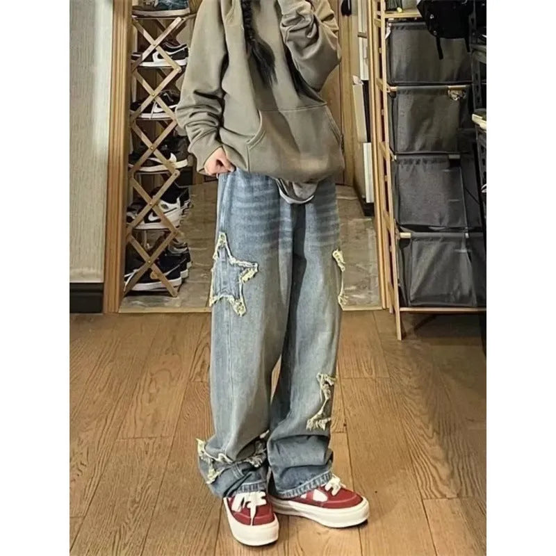 Blue high-waisted wide-leg denim trousers with straight-leg design on hanger