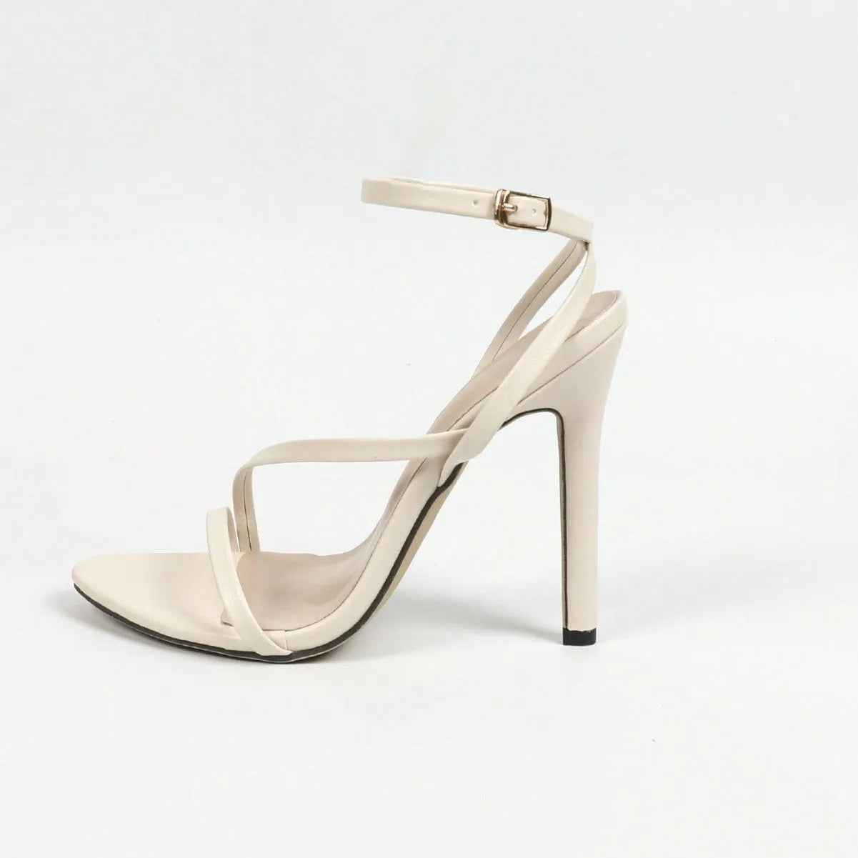 Women's gold ankle strap high heels with open toe and multi-stripe design on a rubber sole.