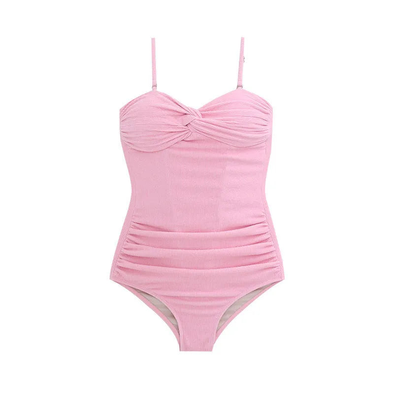 Black women's one-piece swim jumpsuit with suspender straps and a high-waist slimming design.