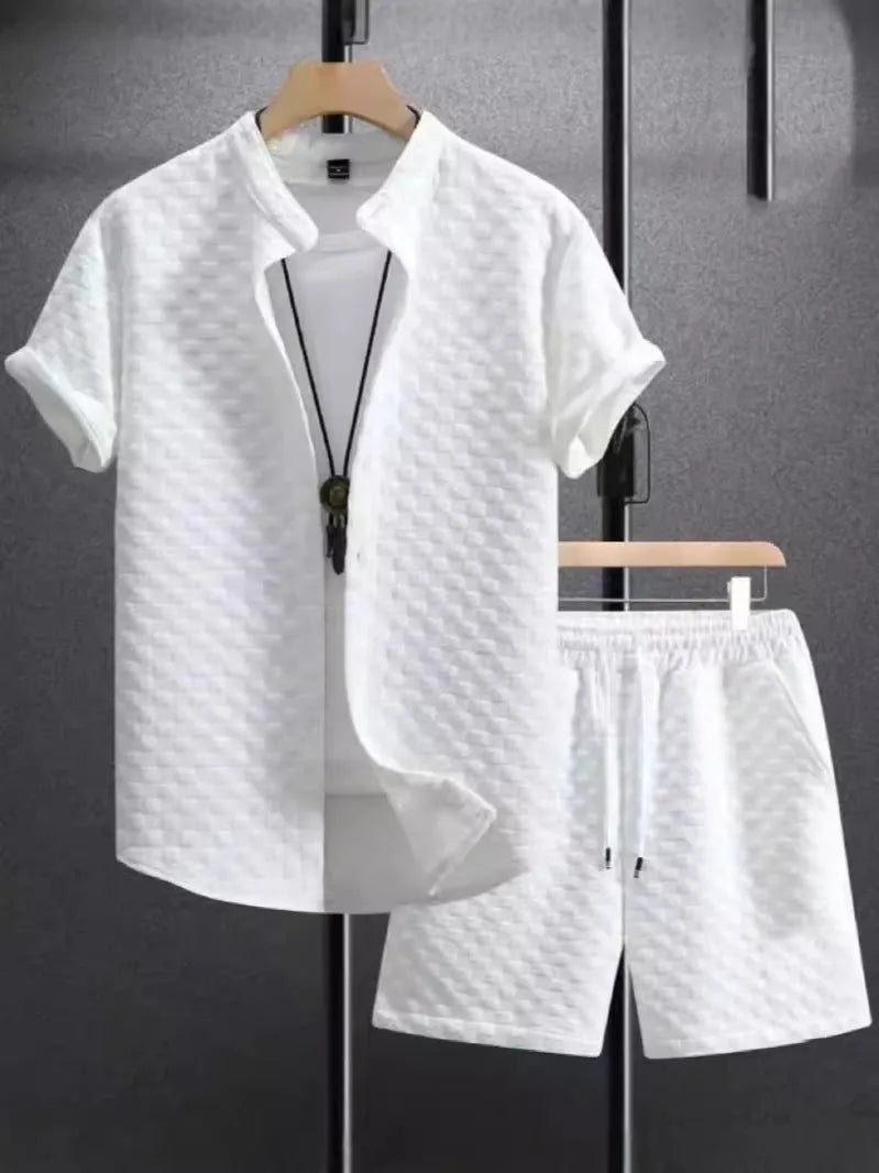 Man wearing black and white jacquard print short sleeve suit with shirt-style jacket and matching shorts