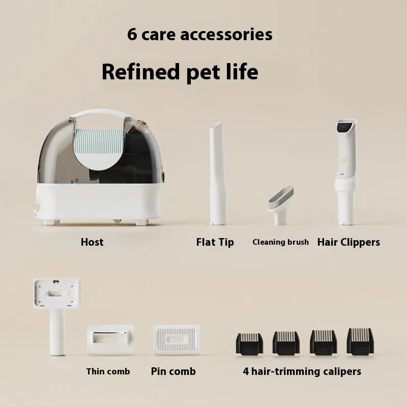 Pink and white pet grooming vacuum cleaner with electric clipper, hose, and grooming attachments
