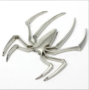 3D metallic spider bumper sticker in gold, silver, black, and red colour options.