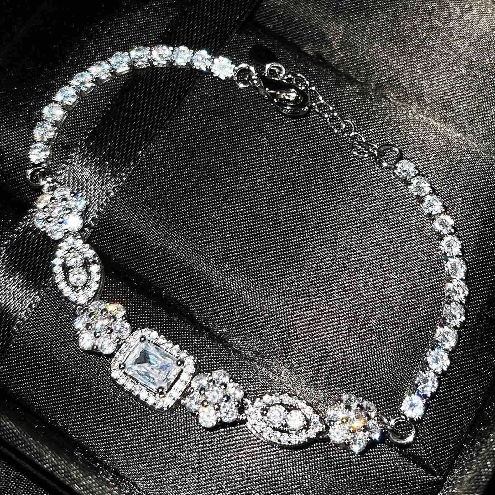 Women's geometric silver-plated bracelet with zircon stones showing adjustable and fixed length options
