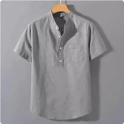 Men's casual beige linen short sleeve shirt with a stand collar and loose fit on a hanger.