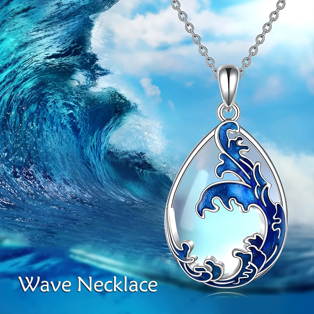 Blue heart-shaped alloy pendant necklace on a silver-tone chain.