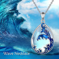 Blue heart-shaped alloy pendant necklace on a silver-tone chain.
