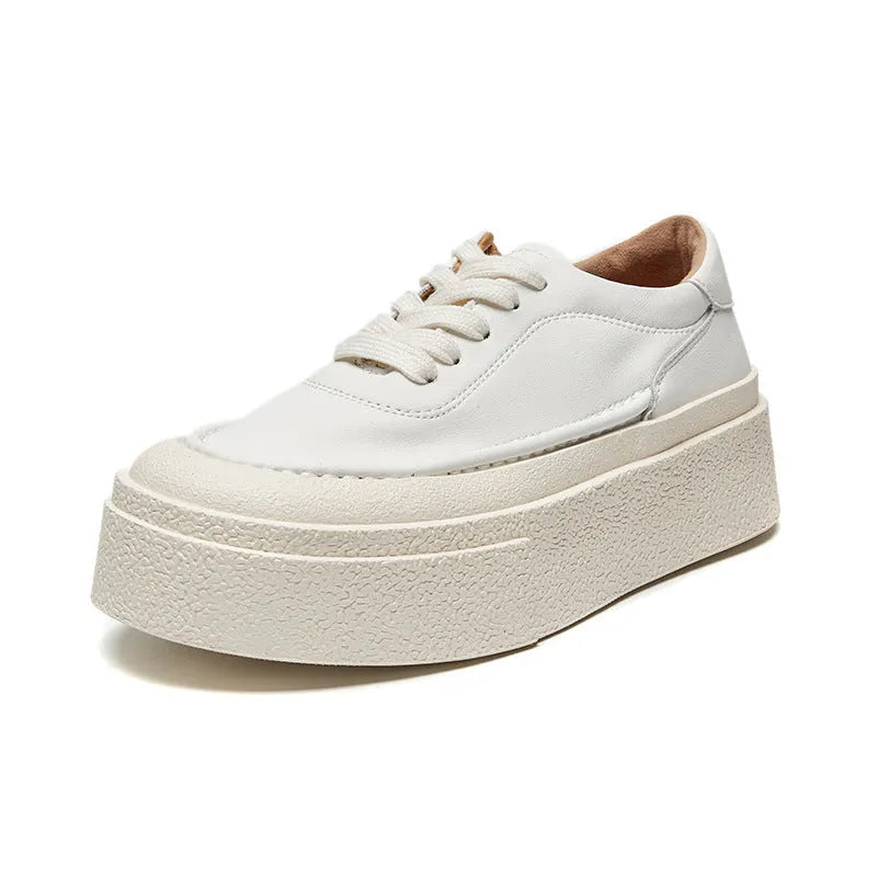 Women's black platform casual board shoes with embossed cowhide upper and round toe design