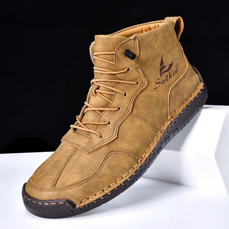 Men's beige retro high-top casual boots with elastic band and round toe on a non-slip rubber sole.