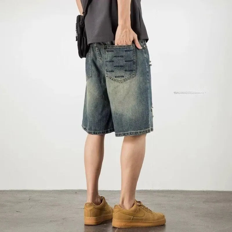 Blue retro denim men's shorts with distressed holes and straight leg cut