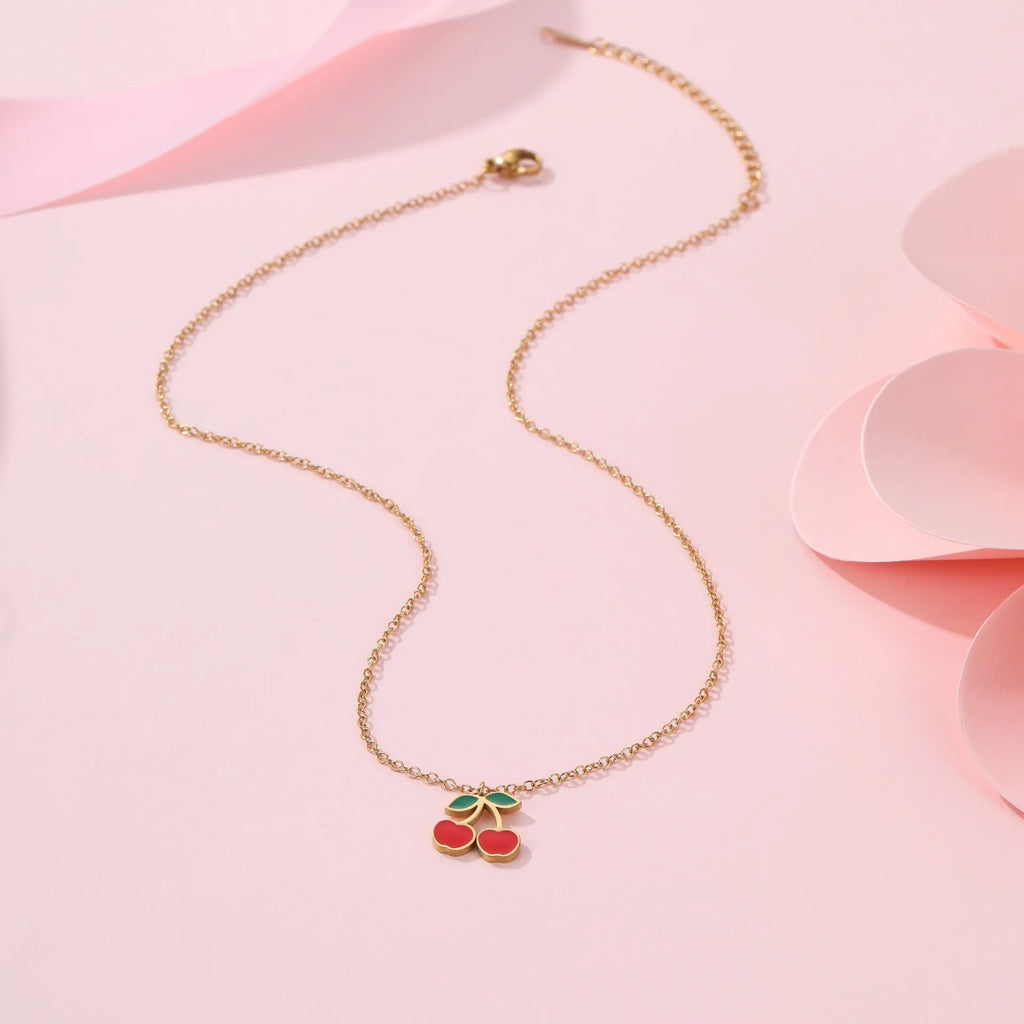 Cherry jewellery set with stainless steel necklace, bracelet, earrings, and ring featuring geometric shapes and 18K plating
