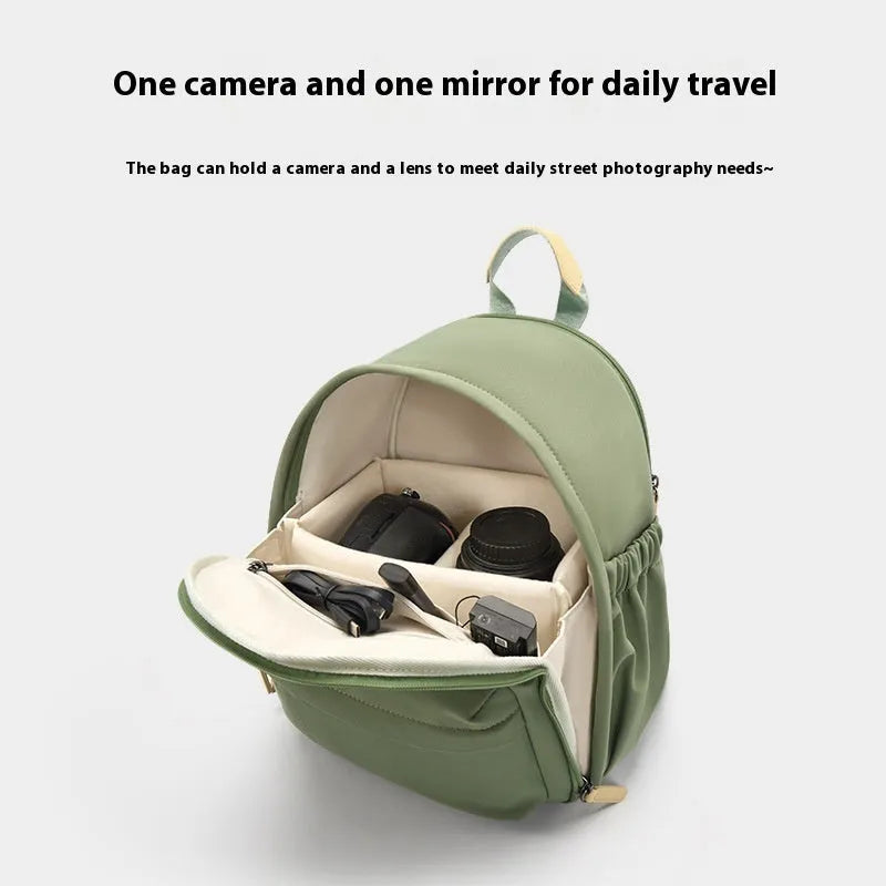 Women's solid-colour shoulder camera bag with a detachable iPad pocket in splash-proof polyester fabric.
