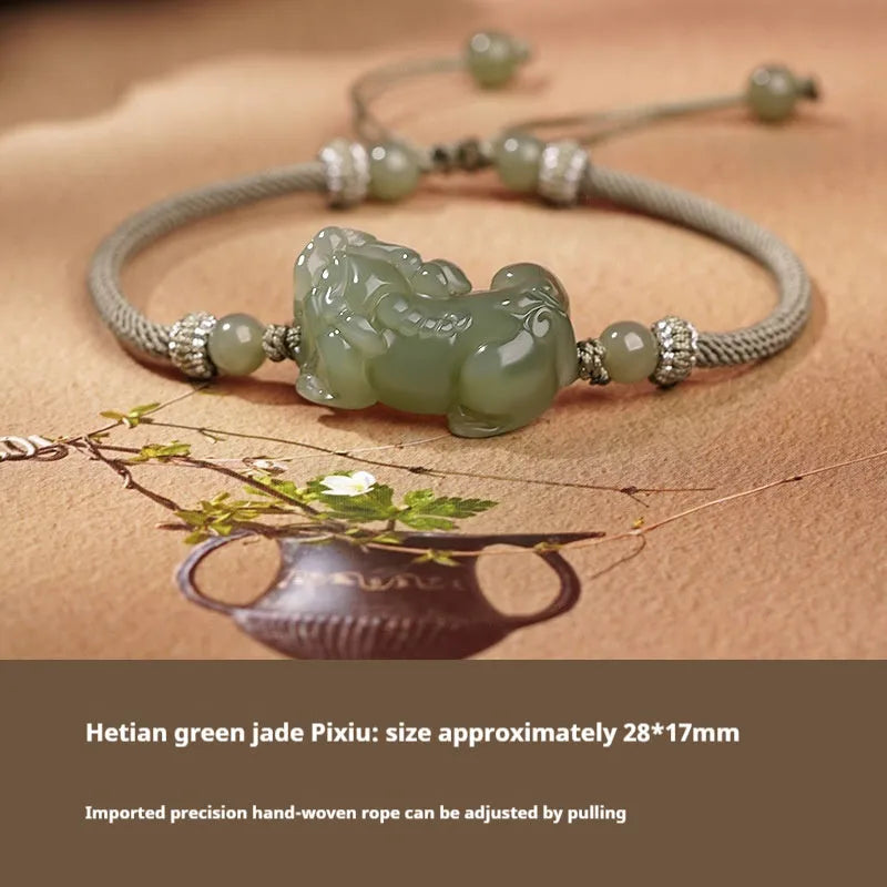 Hetian Jade bracelet with a black and red braided rope band and a central jade bead.
