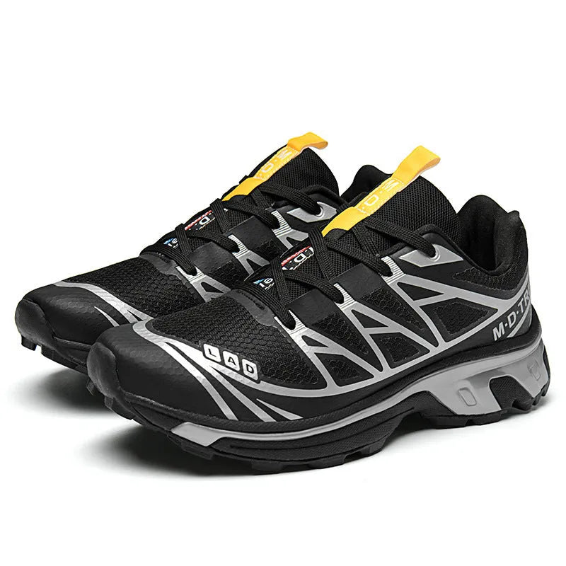 Low-top hiking shoes in khaki with rubber soles and front lace-up closure.