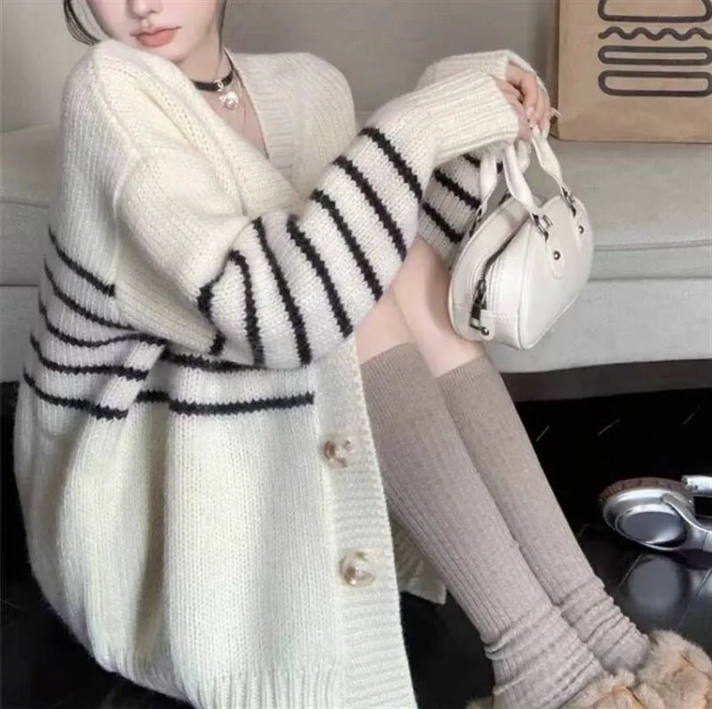 Collar button cardigan in pictured colour with 3D effect polyester fabric.