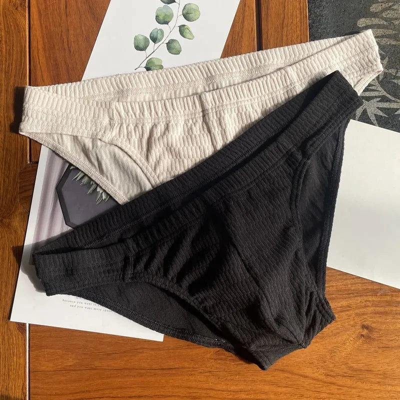 Men's solid colour cotton triangle underwear briefs in mid-waist design on a white background