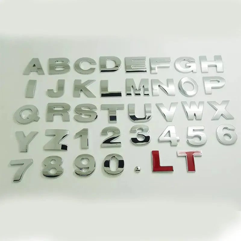 Close-up of a 3D metal zinc alloy letter 'A' car bumper sticker in silver finish.