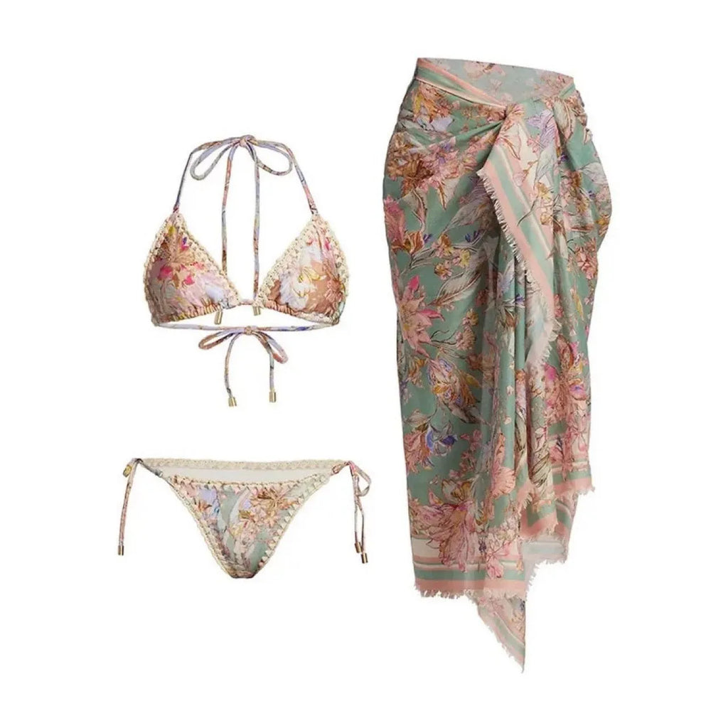 Women's creamy white floral bikini set with skirt cover-up on beach