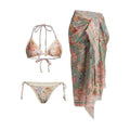 Women's creamy white floral bikini set with skirt cover-up on beach