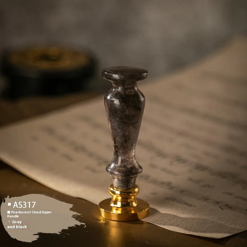 Wooden wax seal handle in a selection of different colour and decorative finishes.