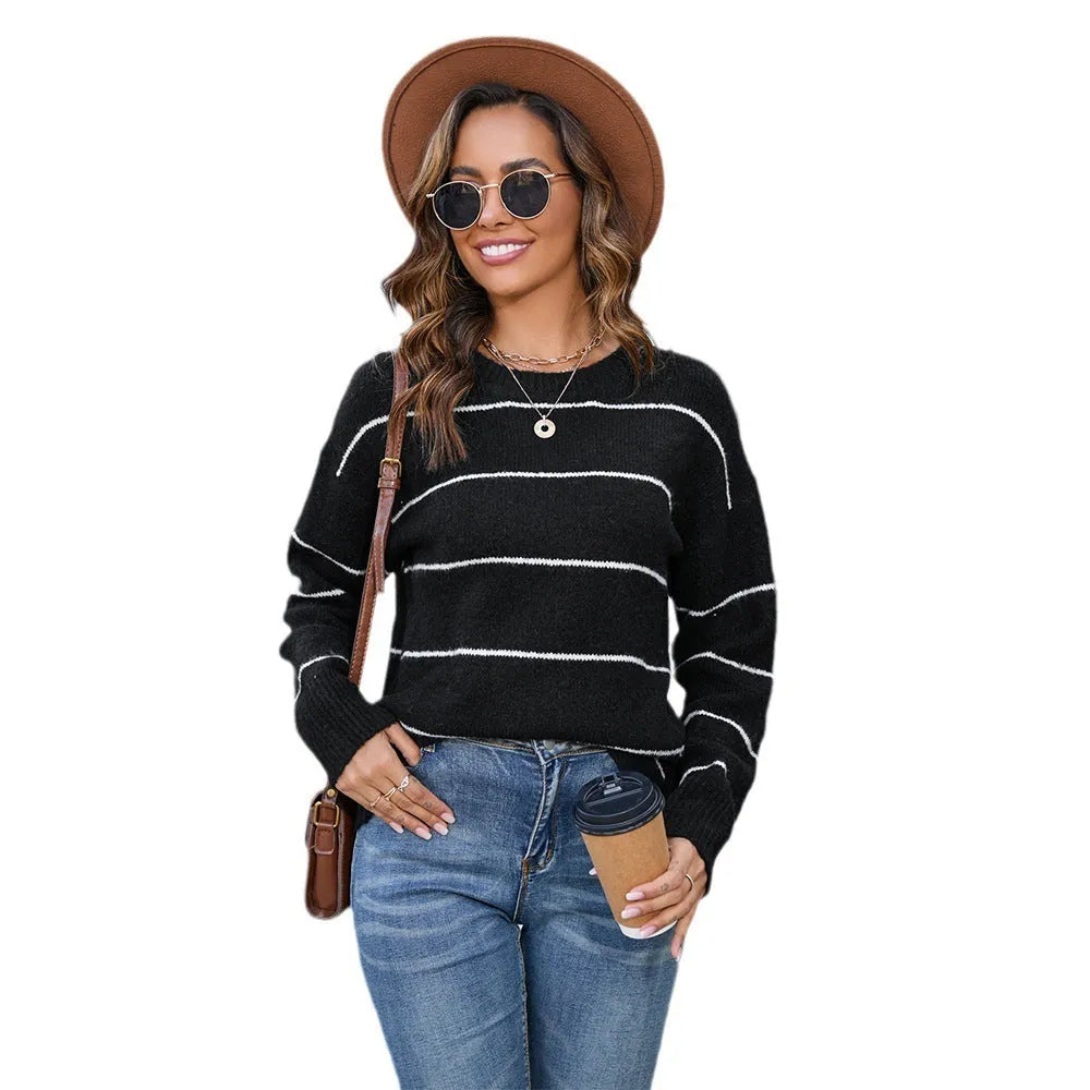 White and black striped women's pullover sweater with round neck and loose street fashion style